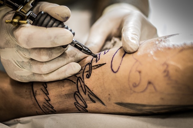 Arm being tattooed