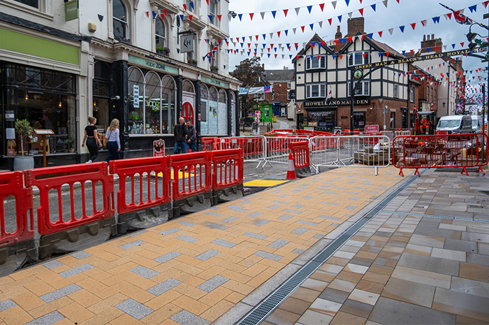 Section of St john st showing new yellow block paving for loading bay and Derbyshire blue/grey flagstones for the pavement